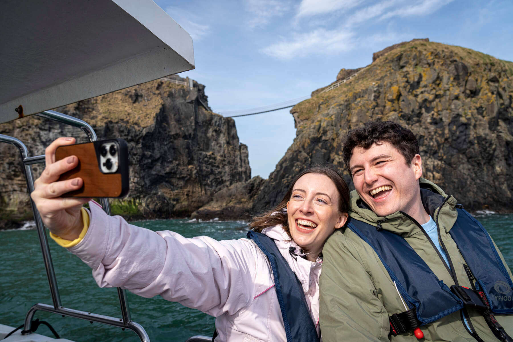 Couple taking photograph on a boat