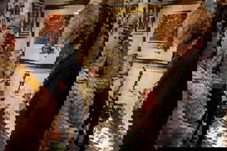 Tour guide playing bodhran as part of Belfast Music Tour